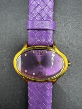 Joan Rivers Womens Watch 39mm Oval Purple Dial Gold Tone Woven Leather Band
